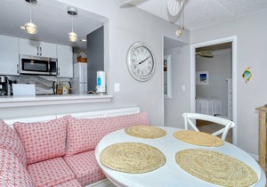 LaPlaya 202E-Catch the gentle Gulf breezes on your private balcony beneath the swaying palms.