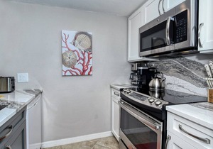 LaPlaya 202E-Catch the gentle Gulf breezes on your private balcony beneath the swaying palms.