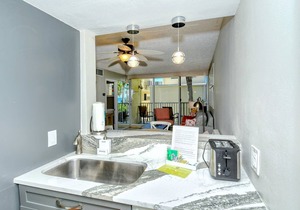 LaPlaya 202E-Catch the gentle Gulf breezes on your private balcony beneath the swaying palms.