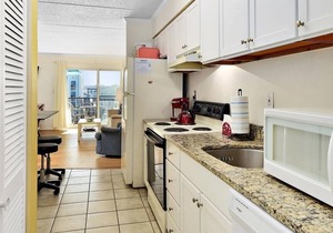 Lovely 1-bedroom condo with free WiFi, cute coastal decor, and an outdoor pool located midtown and just steps to the beach!