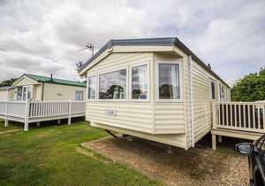 Lovely caravan for hire with decking at Skipsea Sands Holiday Park ref 41161WF