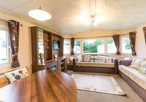 Lovely caravan for hire with decking at Skipsea Sands Holiday Park ref 41161WF