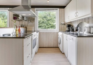 Lovingly furnished cottage on well-kept grounds with lawn and space for ball games.