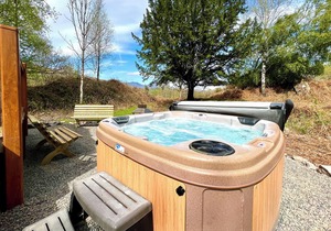 Modern and contemporary lodge style holiday home set in woodland area.