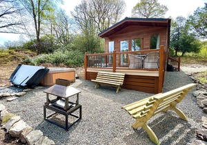 Modern and contemporary lodge style holiday home set in woodland area.