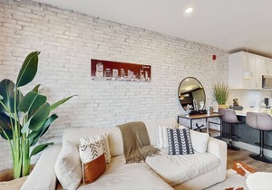 Modern Muse downtown condo with private balcony, central AC, & rooftop lounge