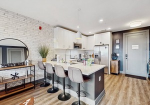 Modern Muse downtown condo with private balcony, central AC, & rooftop lounge