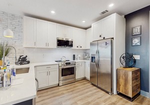 Modern Muse downtown condo with private balcony, central AC, & rooftop lounge
