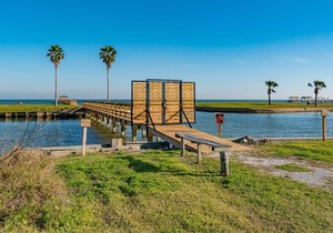 Rockport Racquet and Yacht Club condo with lovely tree covered grounds, pool, and fishing!