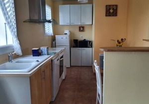 Single-story house with garden, pets on request, near the beach