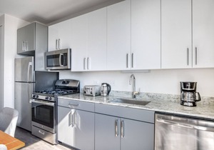 Stunning Logan Square 2BR w/Roof Deck & Gym, 1 block to L, by Blueground