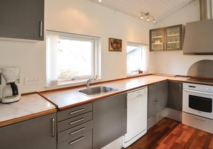 The cottage is beautifully placed on a large fenced natural ground, where lawn has been laid.