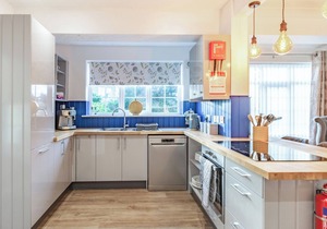 The open plan living area and interior design are a delight.