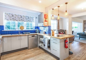 The open plan living area and interior design are a delight.