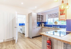 The open plan living area and interior design are a delight.