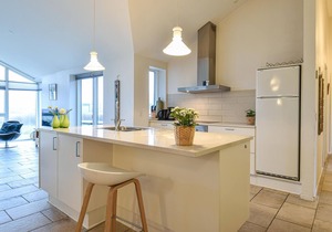This well-equipped vacation home is located just a short walk from the sparkling North Sea with its