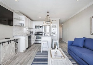 Trendy Beach Condo- Sunset views, Sandy Toes, Surfing more. (1304)