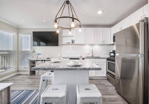 Trendy Beach Condo- Sunset views, Sandy Toes, Surfing more. (1304)