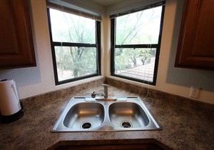 Tucson flair in this 2nd floor-serene patio -close to main pool- exercise rm