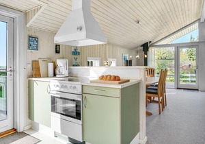 Welcome to this very well maintained cottage with good terraces and a large lawn.
