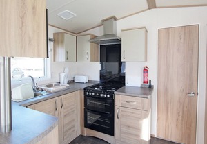 Wheelchair friendly caravan with one double and one twin.