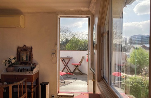 Arcueil Apartment | Bedroom, bathroom and terrace in artist's loft-atelier.