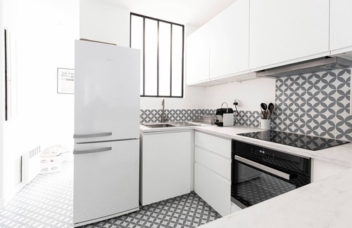 Ternes Apartment | Bright Whites on Pereire Promenade, by Veeve