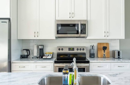 Katie Hill Neighborhood Apartment | 10 Min to DT - Rooftop Garage Firepit W D