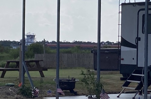 Port Bolivar House | 10 minutes walk to the beach .Covered rv spot on concrete slab. NEW CAMPER