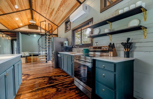 Holiday Island Cabin | 1870 Luxury Art Deco Train Depot at the Lake