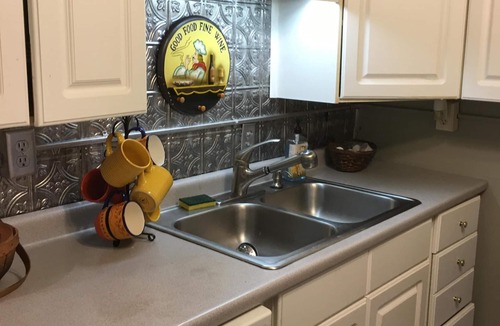 East of Broadway Cottage | 1882 Carriage House In The Heart Of The City!