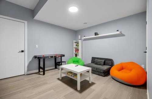 Airdrie Apartment | 1BR Entertainment Space Projector and Games Room
