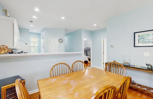 Sunset Beach Condo | 1st-floor corner condo with water view, on-site pool, & screened patio