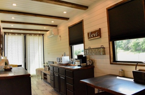 China Spring House | 2-bedroom Tiny Home on 42 Acres in Magnolia Ranch Waco has AC, Stock Ponds.