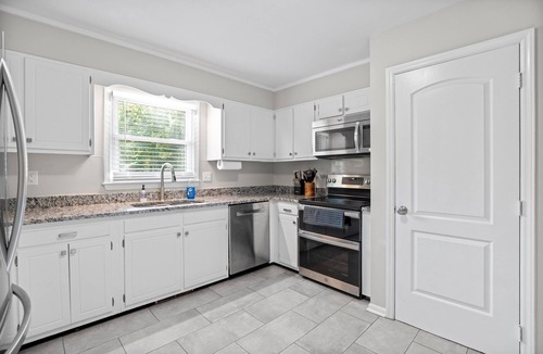 Greensboro House | 2 Kitchens 3 Living Spaces Perfect for Groups Basketball Goal Fire Pit