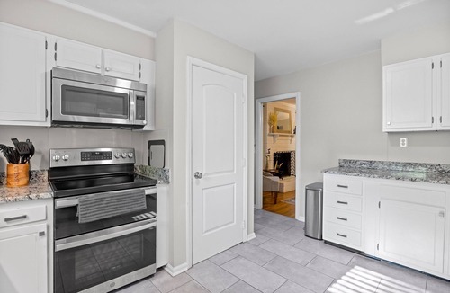 Greensboro House | 2 Kitchens 3 Living Spaces Perfect for Groups Basketball Goal Fire Pit