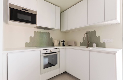Bagneres-de-Bigorre Apartment | 2-room architect-designed apartment with covered balcony facing the spa