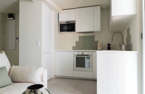 Bagneres-de-Bigorre Apartment | 2-room architect-designed apartment with covered balcony facing the spa