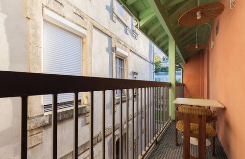 Bagneres-de-Bigorre Apartment | 2-room architect-designed apartment with covered balcony facing the spa