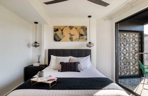 Centro Apartment | 2BR Apt w/Balcony: Gym, Rooftop+Fire Pit, Lounge/Games