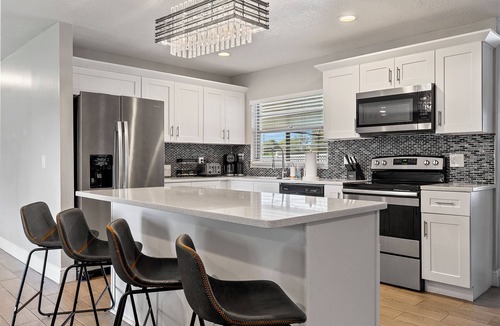 Florida Central Atlantic Coast House | 3/2 plus bonus room W/heated pool & jacuzzi centrally located