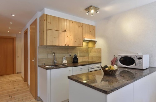 Grimentz Apartment | 3-room apartment for 5 persons : Living room with 1 sofa-bed - kitchen with dishwasher and microwave