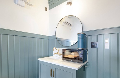 Poulsbo House | 3 rooms at Historic Hotel Scandi with living area, 3 kitchenettes, & city views