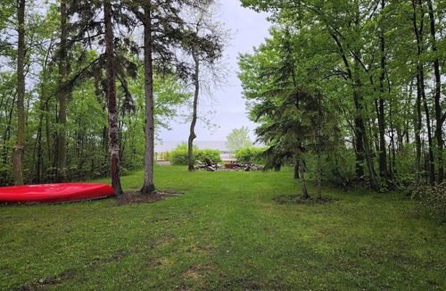 Beaconia House | 3BR Harbor Front House with Fire Pit Canoe, Hammock & Bikes near Grand Beach.