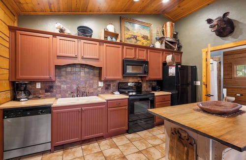 Branson Theater District Cabin | "417 Dirt Road" Cabin for Two - Soaking Tub, Gas Fireplace, Covered Balcony
