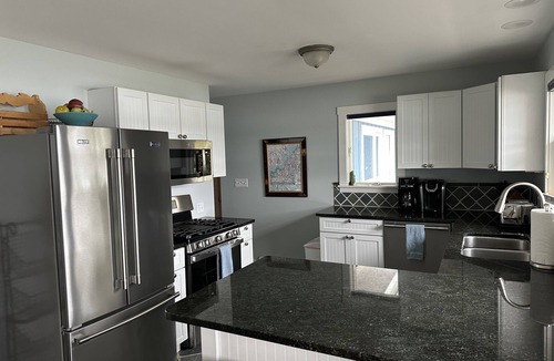 Suttons Bay Cottage | 4BDR/3BTH waterfront home, dock, firepit, sunsets & in the heart of winecountry