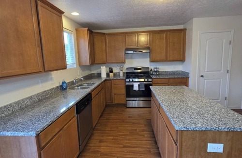 Reynoldsburg House | 4BR, 2.5BA Home - 2 Lounges + Deck + Open-Layout