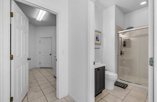 Trafalgar Village Villa | 4BR Modern Home in Kissimmee Sleeps 10 with Heated Pool and BBQ