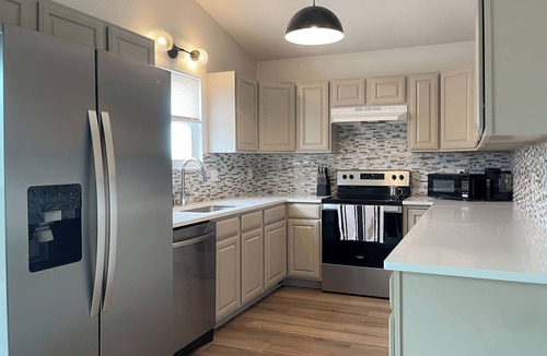 Wichita House | 4BR Retreat Great for Groups with Office Space, Fire Pit & Large Fenced Yard