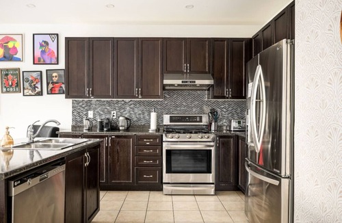 Oshawa Apartment | 4BR Retreat with Hot Tub, Bbq and Pool Table